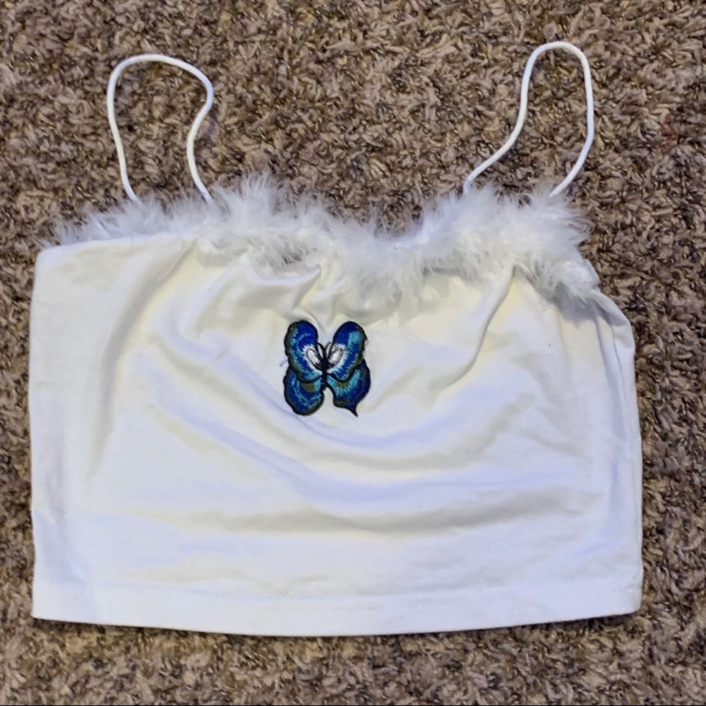 white cami with fur lined neck and butterfly patch